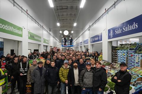 Traders and customers turned out in force to watch the unveiling of the clock